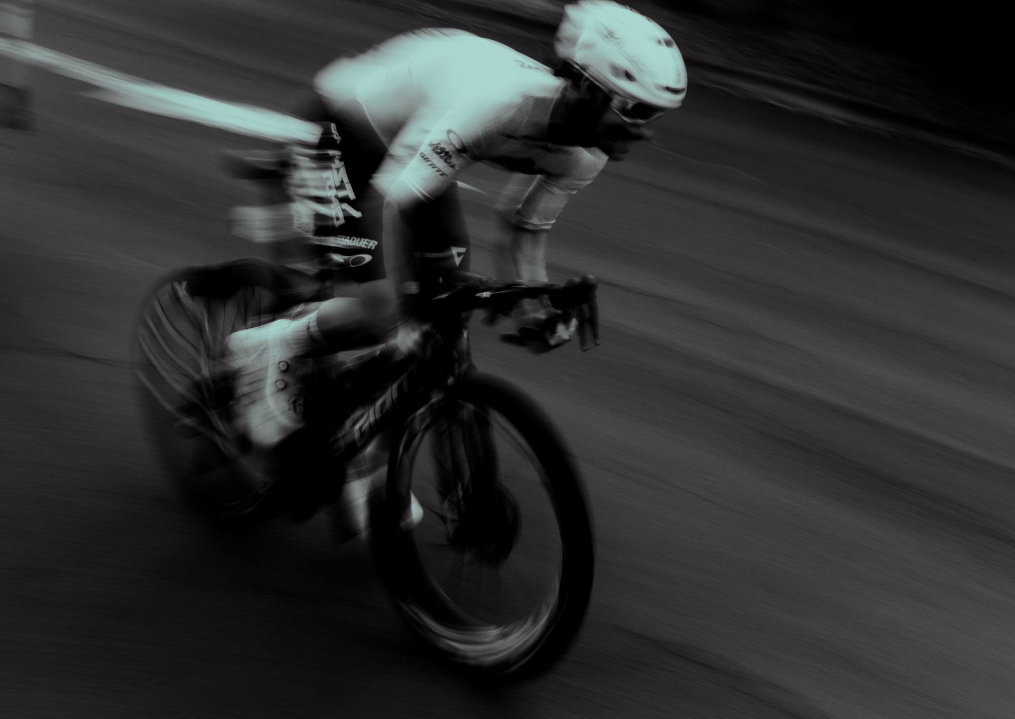 NSTRMO rider at speed, black and white