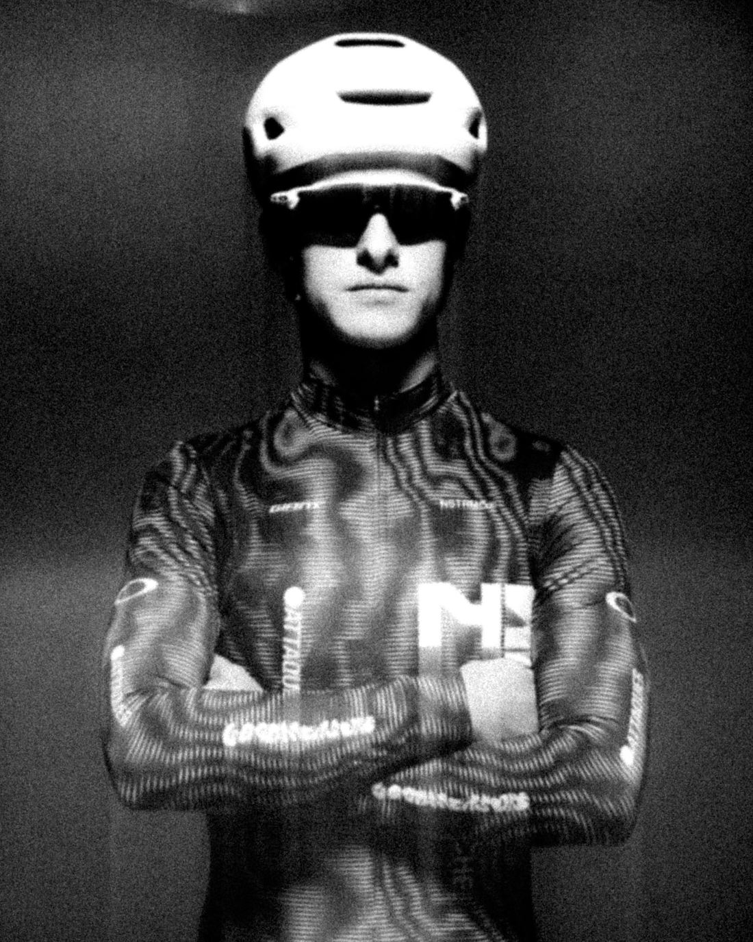 NSTRMO rider portrait in the skinsuit, arms crossed, black and white