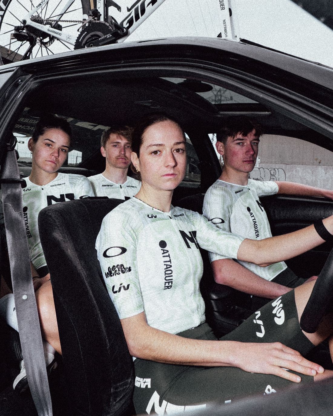 Four NSTRMO riders inside the team car