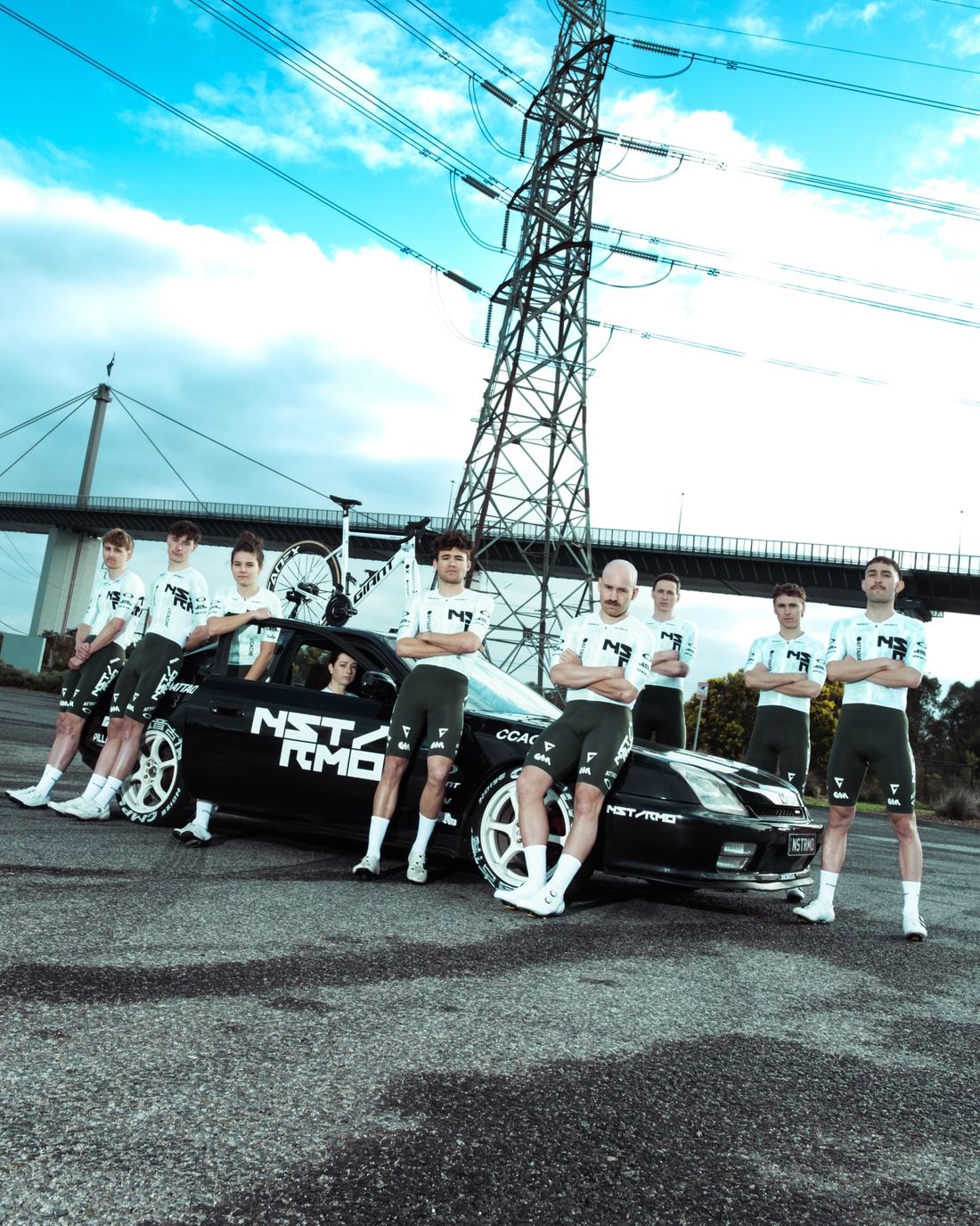 The full NSTRMO squad lined up alongside the team car