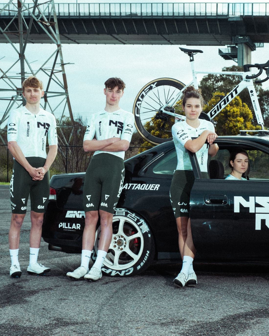 Three NSTRMO riders at the rear of the team car