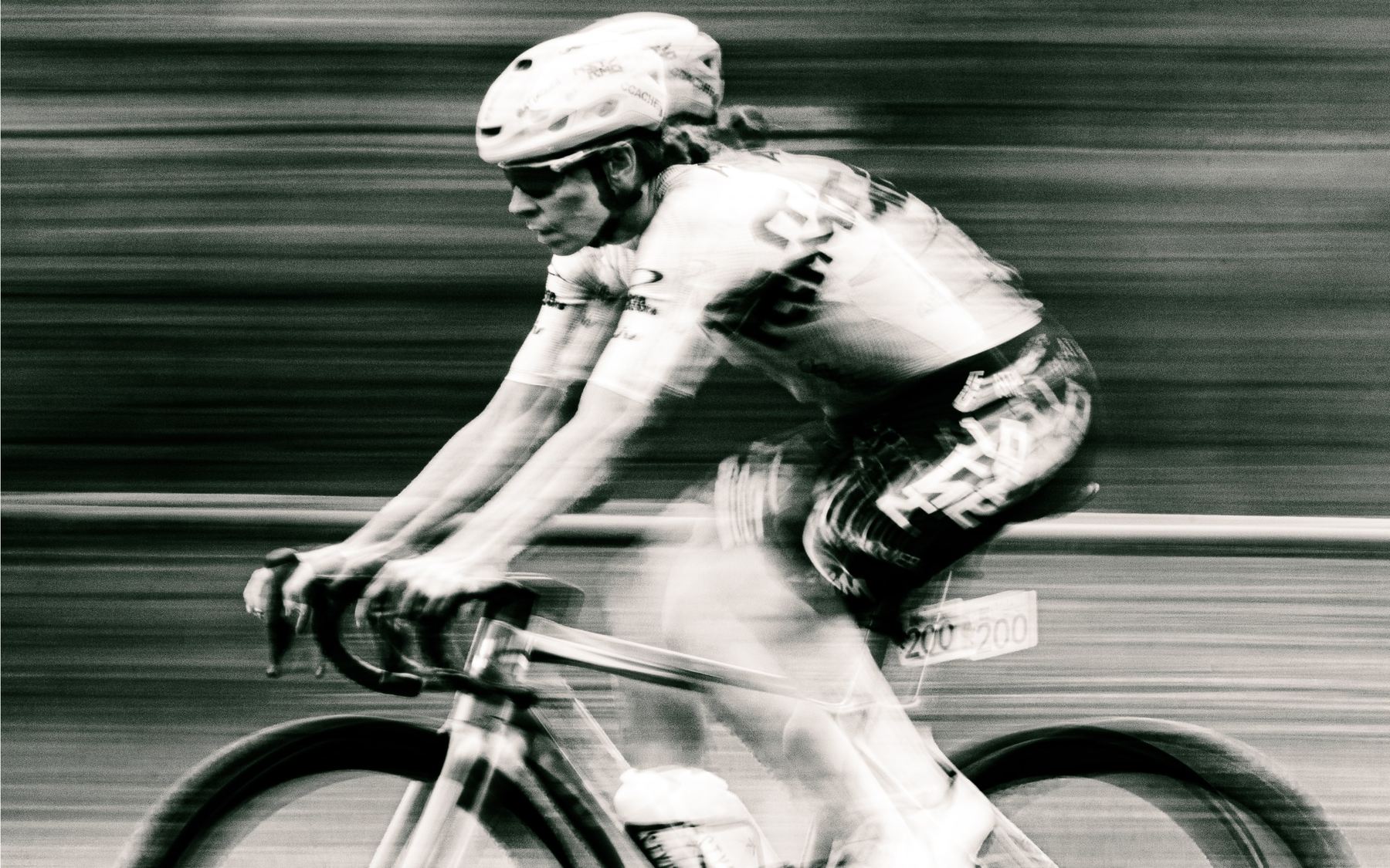 NSTRMO rider at speed, streaked background, black and white